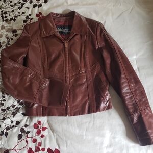 Vintage Wilsons' Women's Brown Leather Jacket Size 12 (Small)
